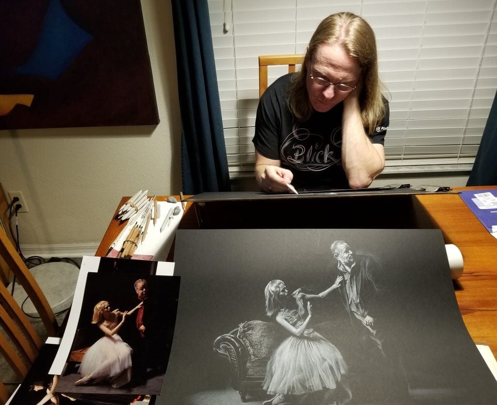 Kevin Grass is shown here working on the final drawing for the Not #MeToo project