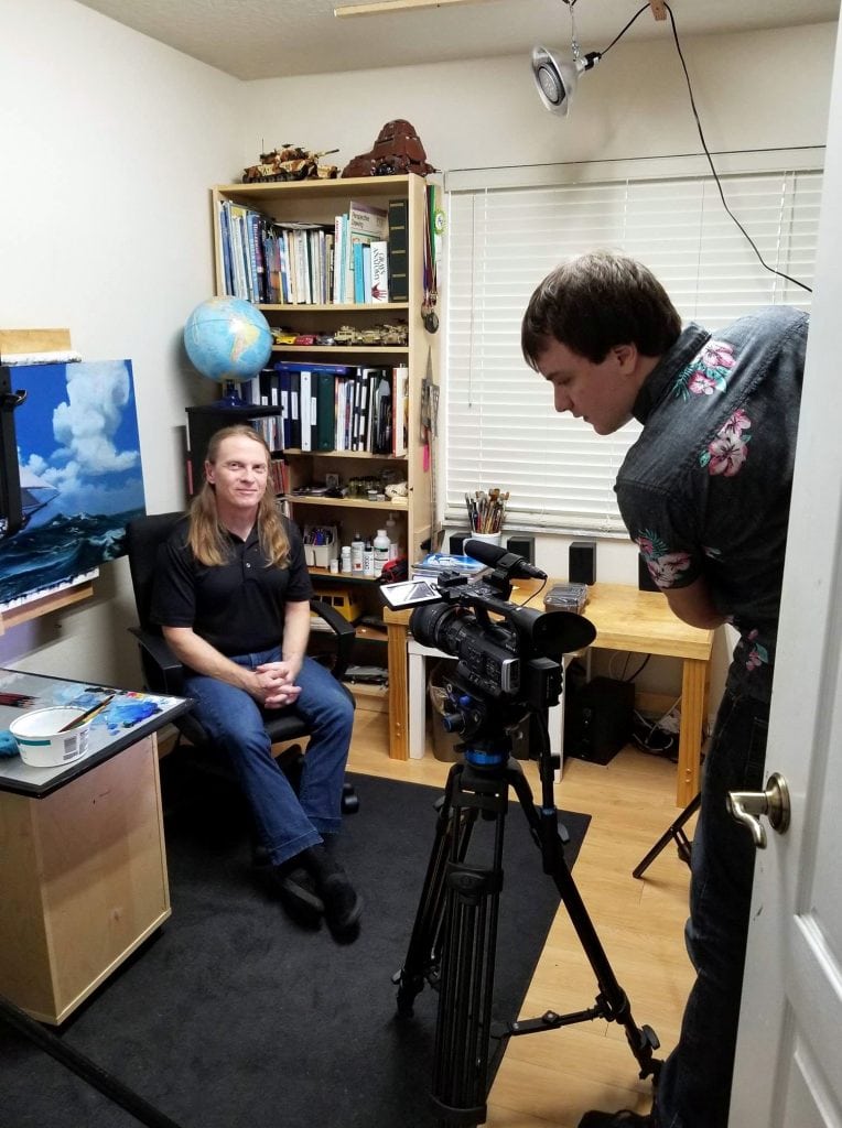 Kevin Grass in his small art studio, about to be filmed