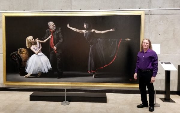 Kevin Grass with his "Not #MeToo: No More Casting Couch" painting at the Leepa-Rattner Museum of Art in Tarpon Springs, FL
