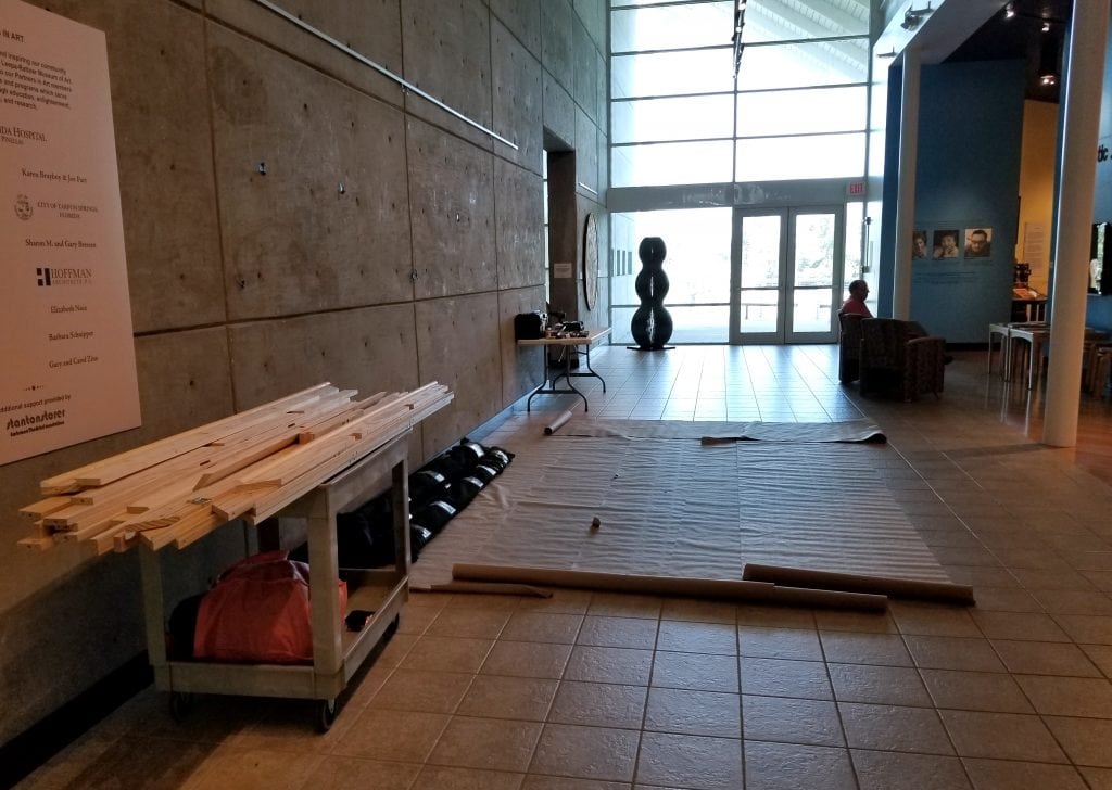 Kevin Grass's "Not #MeToo" painting is rolled up and off the stretcher in this photo