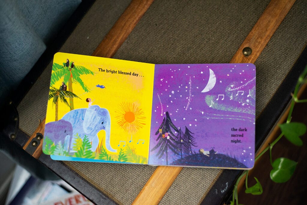 Illustration of the lyrics, "bright blessed day, dark sacred night" in children's book.