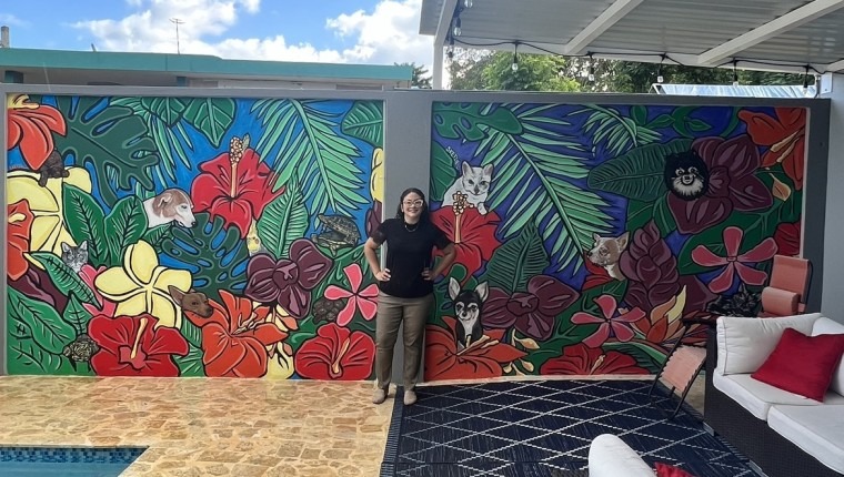 a floral mural with pet portraits