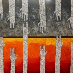 A mixed media artwork depicting hands is on display at The Gallery at Creative Pinellas in Largo.
