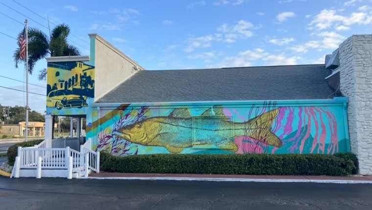 A mural depicts a fish.