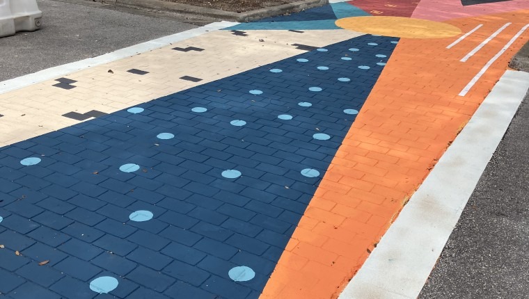 A colorful crosswalk mural.