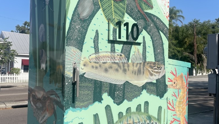 A signal box is decorated with flowers.