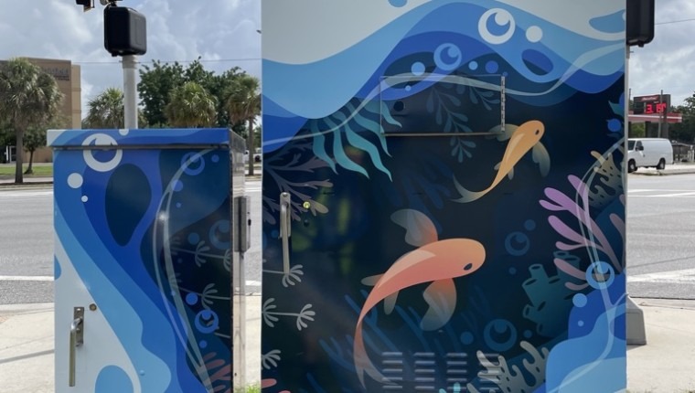 A signal box is decorated with a marine scene.