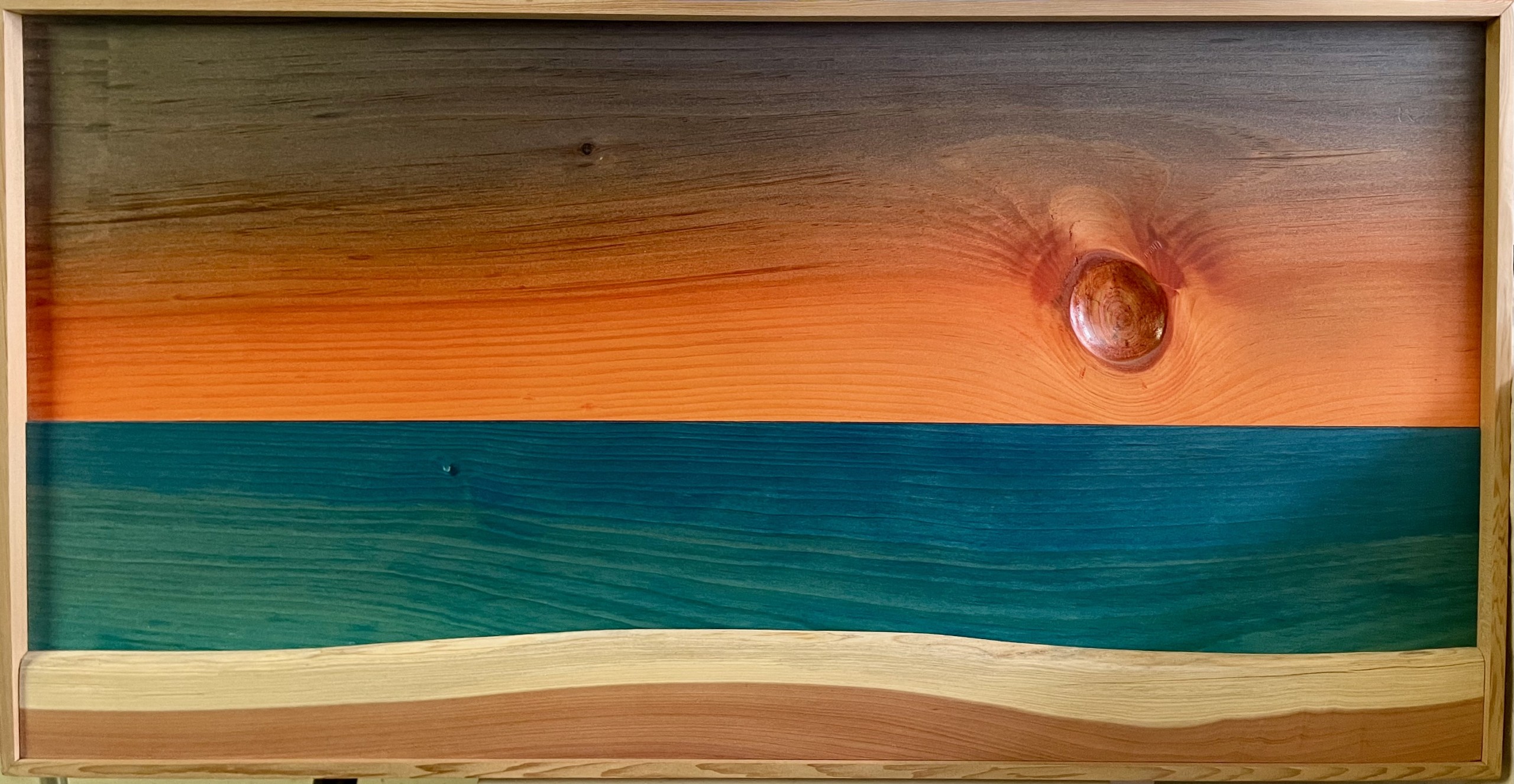 A wood artwork resembles a sunrise.