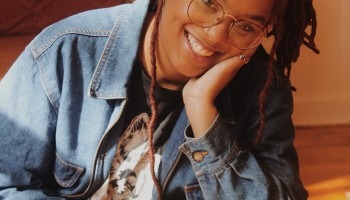 A woman smiles for a photo.